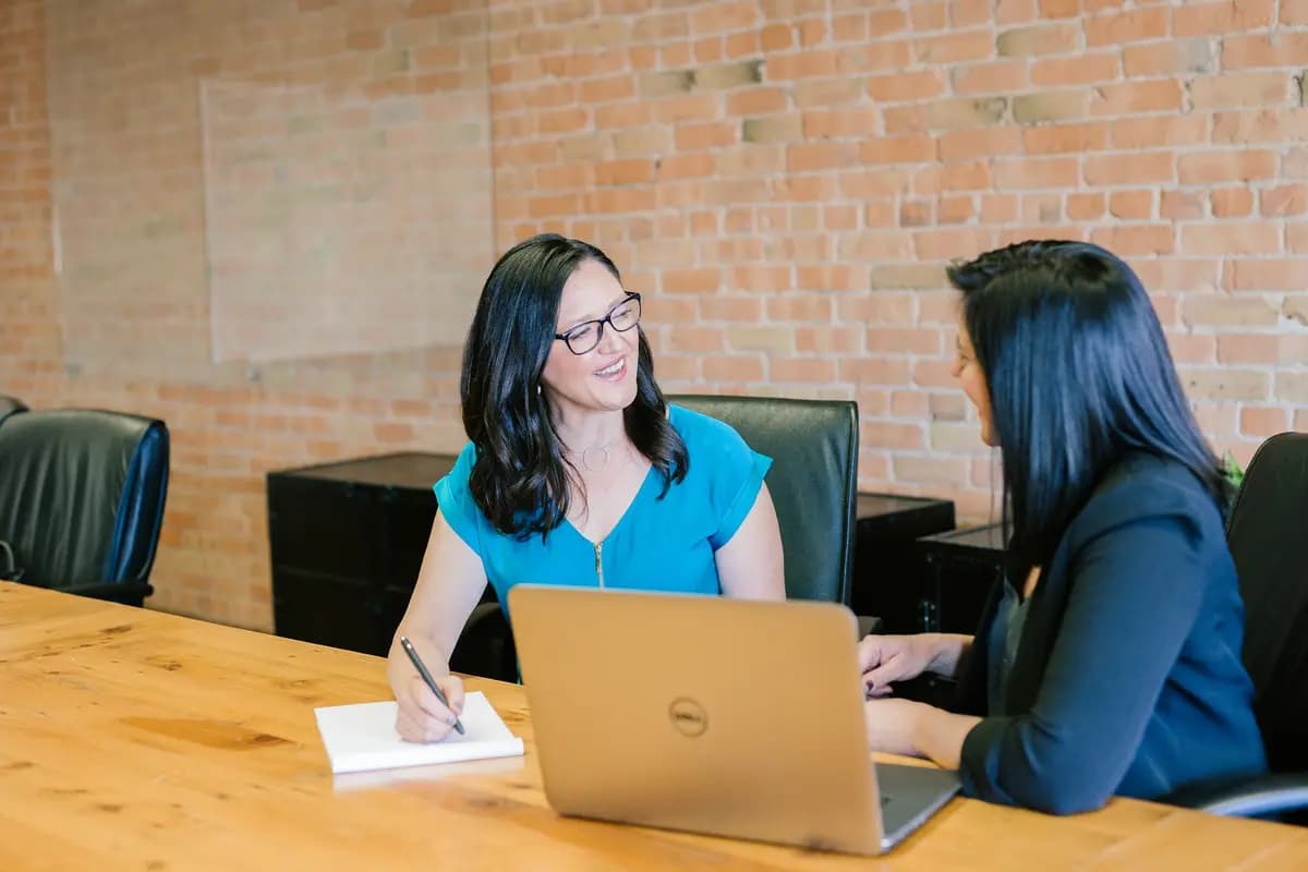 Business owner discussing website requirements with a web developer